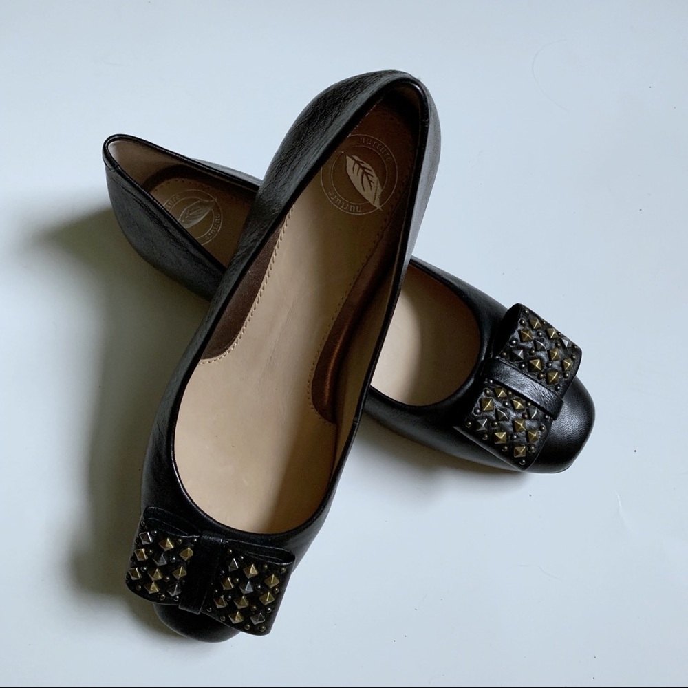 - Nurture black flats with bow metal accents